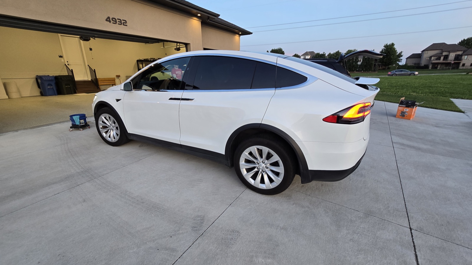 Detailed white Tesla Model X in a driveway