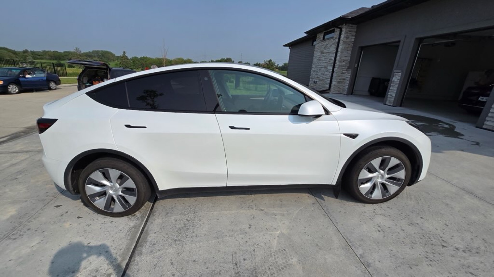 Detailed white Tesla in a driveway