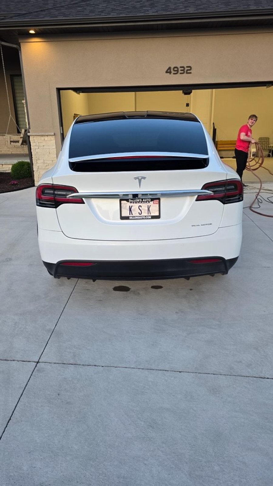 Rinsing a Tesla during an exterior wash